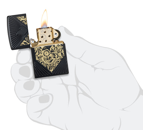 ˫ 2024 Collectible of the Year Windproof Lighter lit in hand.